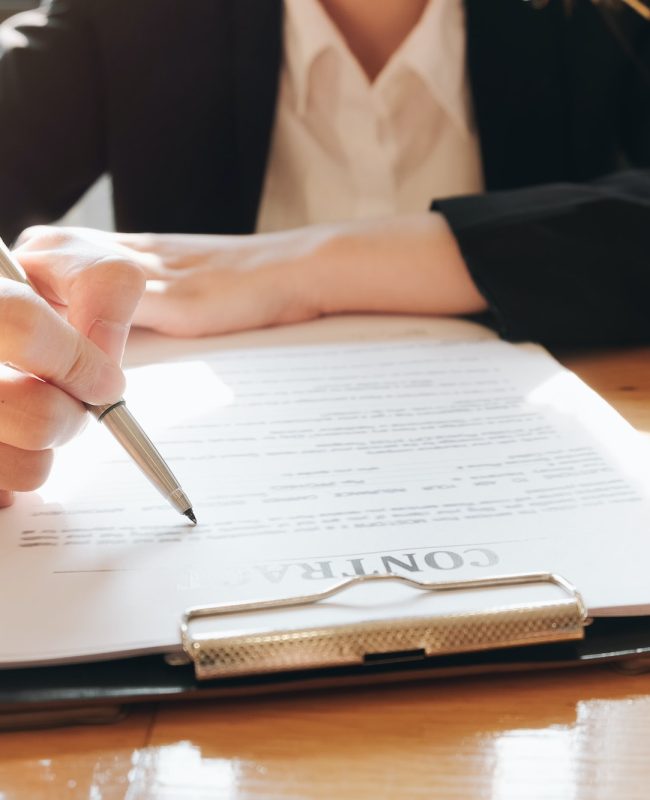 Close up business man signing contract making a deal with business partner - Business deal concept